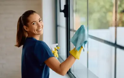 woman cleaning glass window
