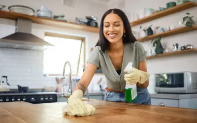 woman cleaning a kitchen counter