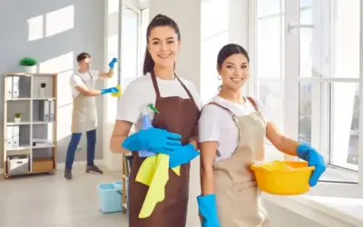 Professional cleaner from Cleaning by Knight wiping a kitchen counter in a Redmond Oregon home